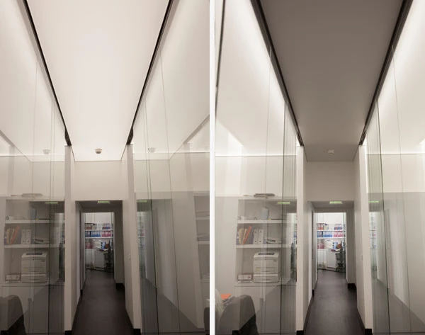 Office corridor looking towards metallic window frames